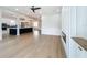 Spacious living room with hardwood floors, recessed lighting, adjacent to an open kitchen, great for entertaining at 217 W Bay St, Winter Garden, FL 34787