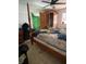 Bedroom with a four-poster bed frame and a classic armoire at 225 Ronnie Cir, Orlando, FL 32811