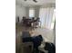 Dining room with seating and natural light through sliding glass doors at 225 Ronnie Cir, Orlando, FL 32811