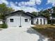 Charming home with a concrete driveway and a basketball hoop at 225 Ronnie Cir, Orlando, FL 32811