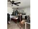 Bright kitchen featuring sleek black countertops and white cabinets at 225 Ronnie Cir, Orlando, FL 32811