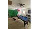 Bright living room featuring a pool table, ceiling fan, and a large window, great for Gathering fun at 225 Ronnie Cir, Orlando, FL 32811