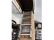 Attic access with folding ladder is located inside the garage at 2346 Lily Pad Ln, Kissimmee, FL 34743