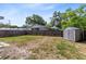 Backyard view of the yard and storage shed at 2401 8Th St, St Cloud, FL 34769
