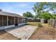 This home features a backyard with a screen patio, storage shed and brick fire pit at 2401 8Th St, St Cloud, FL 34769