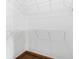 Walk-in closet features white wire shelving and wood-look tile flooring at 2401 8Th St, St Cloud, FL 34769