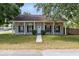Charming single-story home with a covered porch and well-manicured lawn at 2401 8Th St, St Cloud, FL 34769