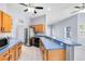 Open kitchen with stainless steel appliances and a breakfast bar at 2401 8Th St, St Cloud, FL 34769