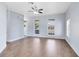 Bright living room featuring wood floors, and multiple windows at 2401 8Th St, St Cloud, FL 34769