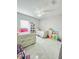 Bright bedroom with two twin beds and a ceiling fan at 247 Whispering Pines Way, Davenport, FL 33837