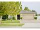 Charming single-story home with a well-manicured lawn and a two-car garage and mature landscaping at 247 Whispering Pines Way, Davenport, FL 33837