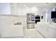 Modern kitchen features sleek countertops, stainless steel appliances, and ample cabinet space, creating a stylish cooking area at 247 Whispering Pines Way, Davenport, FL 33837