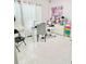 Bright room featuring white floors, large window, and great lighting at 247 Whispering Pines Way, Davenport, FL 33837