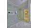 Modern walk-in shower with glass door, bench, and dual shower heads at 247 Whispering Pines Way, Davenport, FL 33837