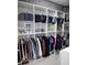 Organized walk-in closet with shelving, hanging space, and dedicated shoe storage at 247 Whispering Pines Way, Davenport, FL 33837