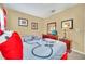 Cozy bedroom featuring two beds with colorful linens and decorative wall art at 2632 Emerald Island Blvd, Kissimmee, FL 34747