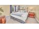 Tranquil bedroom with a king-size bed, side tables, and decorative accents, offering a peaceful escape at 2632 Emerald Island Blvd, Kissimmee, FL 34747