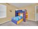 Cozy ' bedroom features a fun bunk bed with a built-in desk, perfect for study and play at 2632 Emerald Island Blvd, Kissimmee, FL 34747
