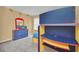 ' bedroom with bunk beds, study area, and dresser, designed for comfort and organization at 2632 Emerald Island Blvd, Kissimmee, FL 34747