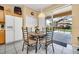 Dining area with views of the screened in lanai and pool at 2632 Emerald Island Blvd, Kissimmee, FL 34747