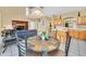 Cozy dining area adjacent to the kitchen, featuring a stone-top table at 2632 Emerald Island Blvd, Kissimmee, FL 34747