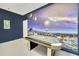 Spacious game room with custom mural and air hockey provides entertainment for all ages at 2632 Emerald Island Blvd, Kissimmee, FL 34747