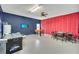 Spacious game room with air hockey, foosball table, and a poker table for entertaining guests at 2632 Emerald Island Blvd, Kissimmee, FL 34747
