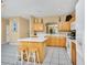 Kitchen with a center island and a breakfast bar at 2632 Emerald Island Blvd, Kissimmee, FL 34747