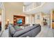 Bright living room featuring high ceilings and a comfortable gray sectional sofa at 2632 Emerald Island Blvd, Kissimmee, FL 34747