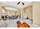 Spacious open concept living room and staircase with tile flooring and views of the dining area at 2632 Emerald Island Blvd, Kissimmee, FL 34747