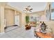 Inviting living room with neutral tones, tile floors, large windows, and comfortable seating at 2632 Emerald Island Blvd, Kissimmee, FL 34747
