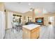 Open living space with dining area and view of the backyard pool at 2632 Emerald Island Blvd, Kissimmee, FL 34747