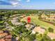 Aerial view of the property and its location, marked by a red pin, near a golf course at 2746 Kissimmee Bay Cir, Kissimmee, FL 34744