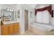 This bathroom features a walk-in shower and a large soaking tub at 2746 Kissimmee Bay Cir, Kissimmee, FL 34744