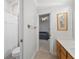 Bright bathroom features a toilet, shower, and vanity with wood cabinets at 2746 Kissimmee Bay Cir, Kissimmee, FL 34744