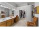 This bathroom features a double vanity and a large walk-in closet at 2746 Kissimmee Bay Cir, Kissimmee, FL 34744