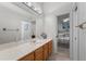 Bathroom with vanity. Bedroom with bed in background at 2746 Kissimmee Bay Cir, Kissimmee, FL 34744