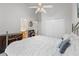 Bright bedroom with high ceilings, a ceiling fan, and view of the bathroom and closet at 2746 Kissimmee Bay Cir, Kissimmee, FL 34744