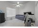 Bedroom with daybed, ceiling fan, and treadmill at 2746 Kissimmee Bay Cir, Kissimmee, FL 34744