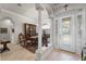 Formal dining room with elegant columns, dining table, and decorative lighting fixture at 2746 Kissimmee Bay Cir, Kissimmee, FL 34744