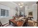 Elegant dining room with ample natural light, decorative columns, and seating for six at 2746 Kissimmee Bay Cir, Kissimmee, FL 34744