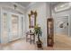 Inviting foyer with decorative tile, glass front door, and elegant decor at 2746 Kissimmee Bay Cir, Kissimmee, FL 34744