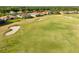 Scenic view of lush golf course and surrounding homes with well-maintained fairways at 2746 Kissimmee Bay Cir, Kissimmee, FL 34744