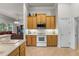 Bright kitchen with a microwave and smooth top stove and pass through to living room at 2746 Kissimmee Bay Cir, Kissimmee, FL 34744