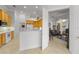 Bright kitchen boasts white appliances and wood cabinetry at 2746 Kissimmee Bay Cir, Kissimmee, FL 34744