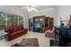 Spacious living room features tile floors, large windows, entertainment center, and comfortable seating at 2746 Kissimmee Bay Cir, Kissimmee, FL 34744