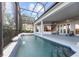 Stunning screened-in pool area with a covered patio and outdoor seating space at 2746 Kissimmee Bay Cir, Kissimmee, FL 34744