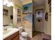 Beach themed bathroom decor with unique sink, mirror, and shower at 2888 Spring Breeze Way, Kissimmee, FL 34744