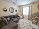 Cozy living room with a comfortable sectional sofa, string lights, and playful decor at 2888 Spring Breeze Way, Kissimmee, FL 34744