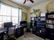 Functional home office with dual monitors, ample desk space, and built-in storage at 2888 Spring Breeze Way, Kissimmee, FL 34744